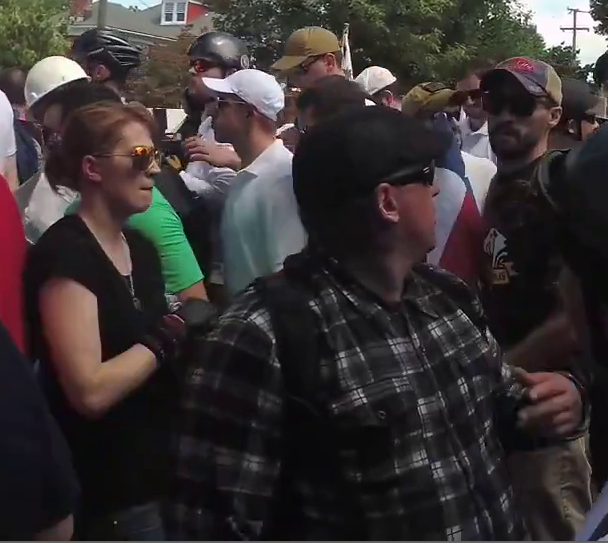 David Aaron Mitchell (right, wearing an "Exodus Americanus" t-shirt), Jennifer Mitchell (left, wearing a black t-shirt) at the "Unite the Right" rally, Charlottesville, 2017.