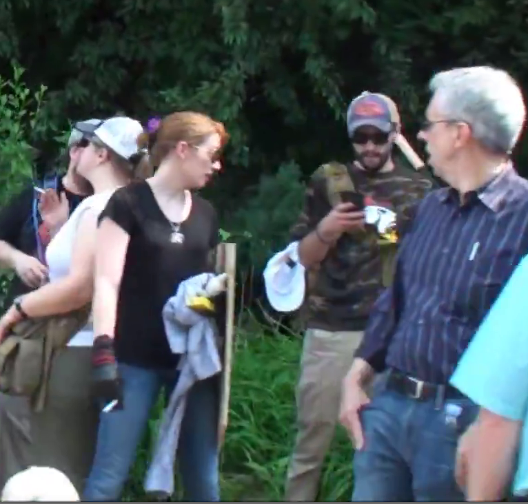 David Aaron Mitchell (right, wearing an "Exodus Americanus" t-shirt), Jennifer Mitchell (left, wearing a black t-shirt) at the "Unite the Right" rally, Charlottesville, 2017.