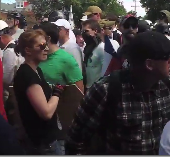 David Aaron Mitchell (right, wearing an "Exodus Americanus" t-shirt), Jennifer Mitchell (left, wearing a black t-shirt) at the "Unite the Right" rally, Charlottesville, 2017.