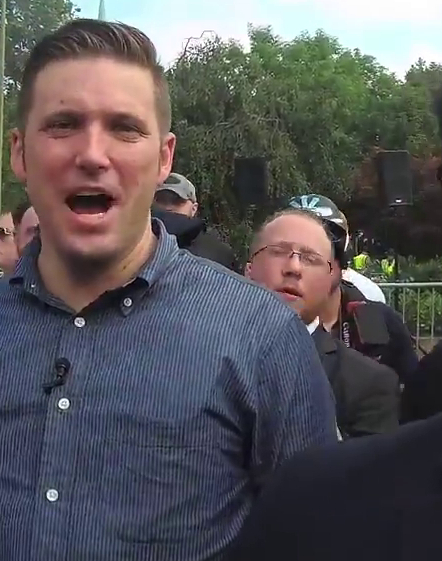 "Jack Pierce" behind Richard Spencer, Charlottesville, 12 Aug 2017.