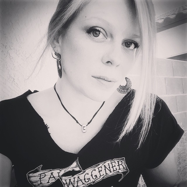 Adrienne Dohrmann wearing a t-shirt with the name of white nationalist cult weirdo and musician Paul Waggener.