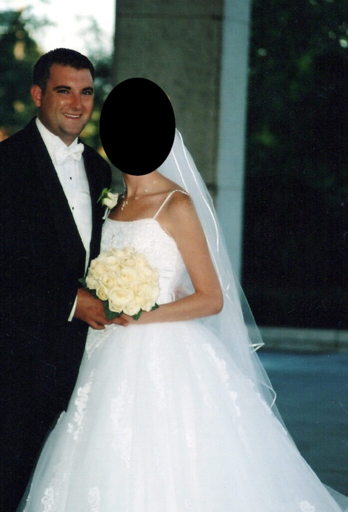 A wedding photo of Aaron Nichols and spouse (readacted), circa 2000-2001.