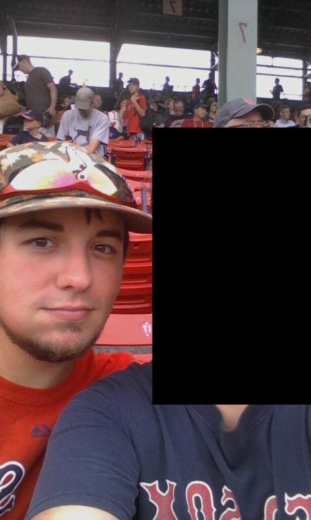 John F. Rokes Jr. (left) with his then-girlfriend and mother of his son (redacted) in a 2012 Facebook photo.