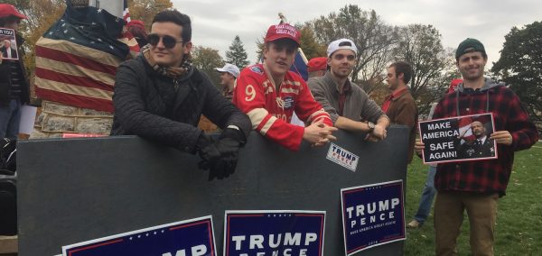 Dimitri Loutsik (left, in sunglasses) at a "Build the Wall" event.