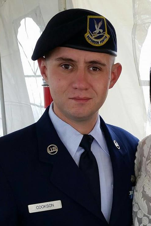 Justin Dean Cook, serving as a security forces airman in the Air National Guard.